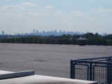 The New York City skyline, across the roof of a New York Times printing plant.